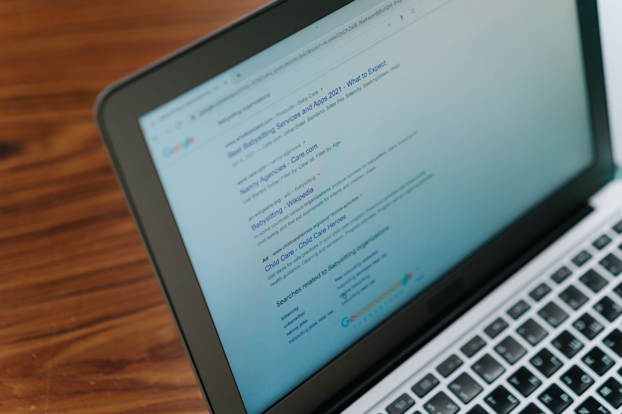 A close-up look at a laptop screen showing a search engine page.
